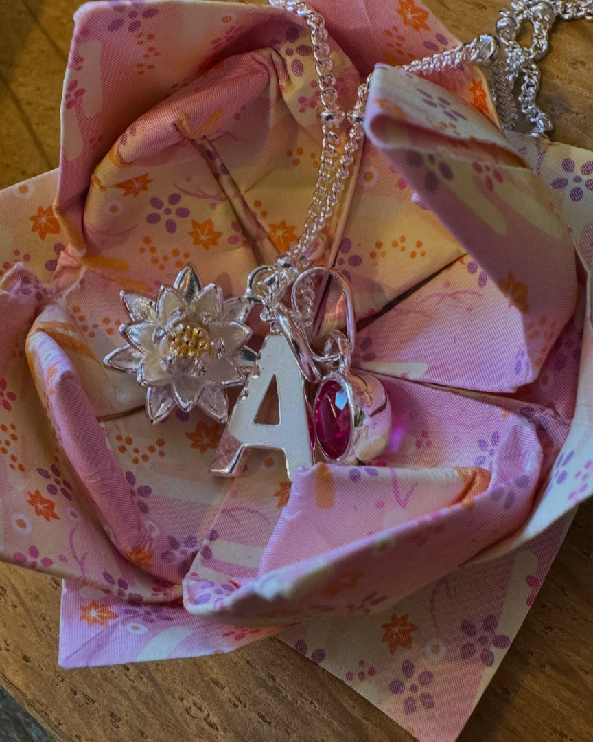 Water lily pendant with initial and cz ruby charm